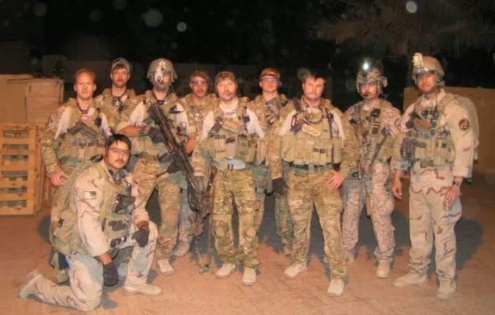 Chad Miller with his military team